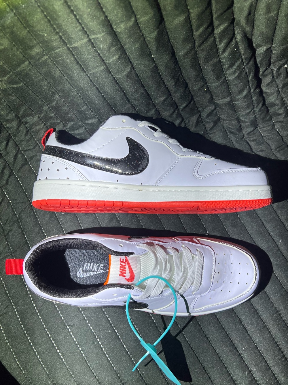 Nike White Low-Top Sneakers with Black Swoosh and Red Outsole - Picture 1 of 8